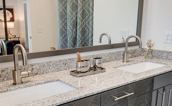 Stunning large bathroom with double sinks in new apartments 